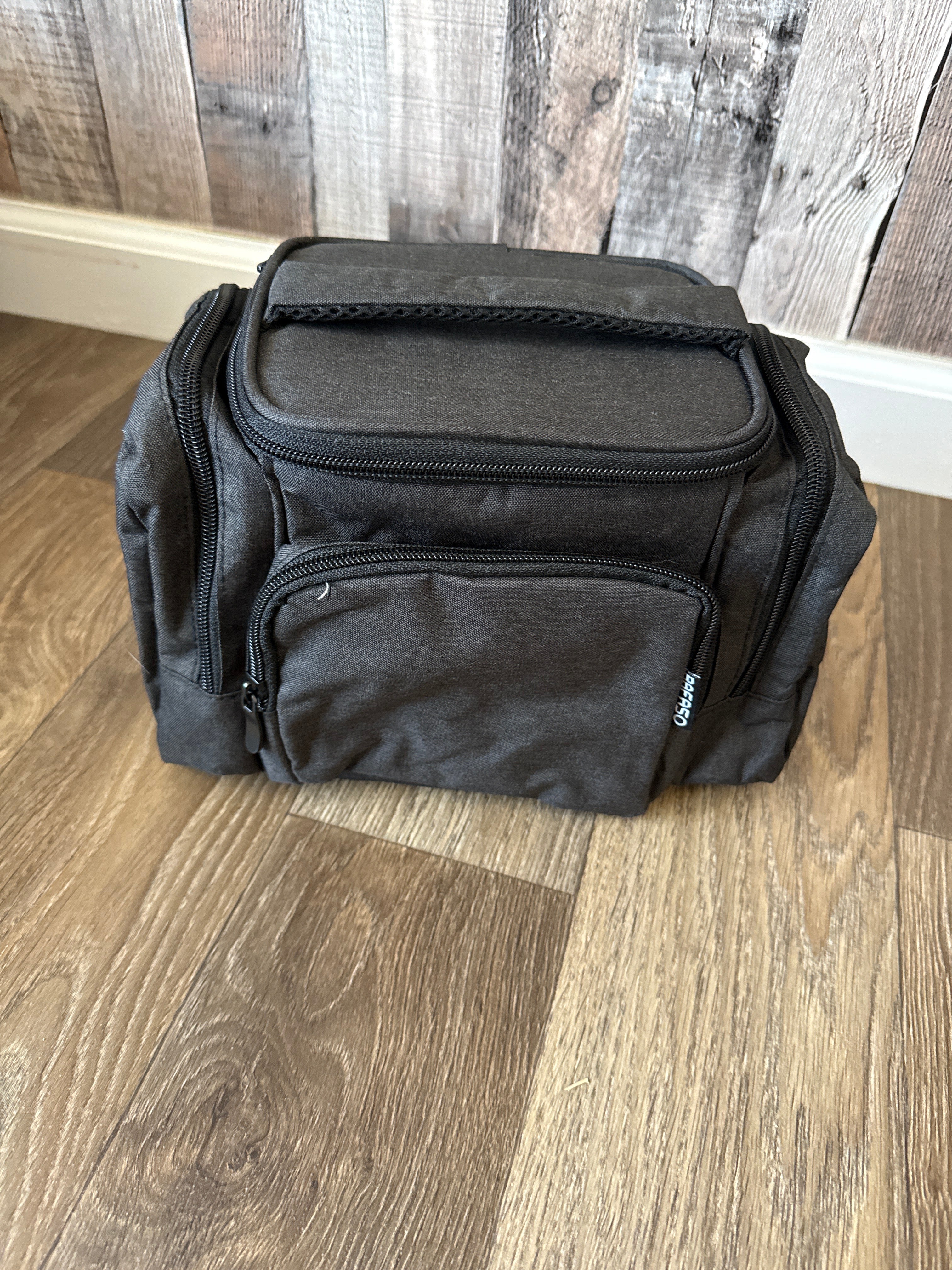 Breast milk cooler bag with pockets for pump